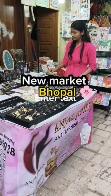 Anjali arranging trays at her New Market stall